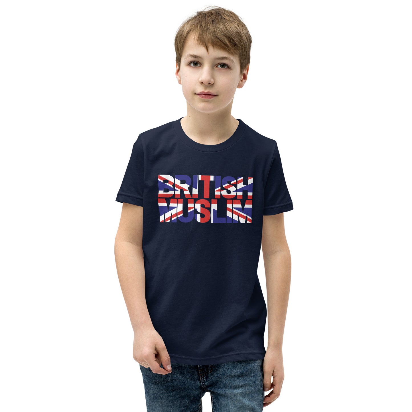 A boy wearing a navy blue coloured Unisex T-shirt with the text saying BRITISH MUSLIM that is also in the colours of the british flag.