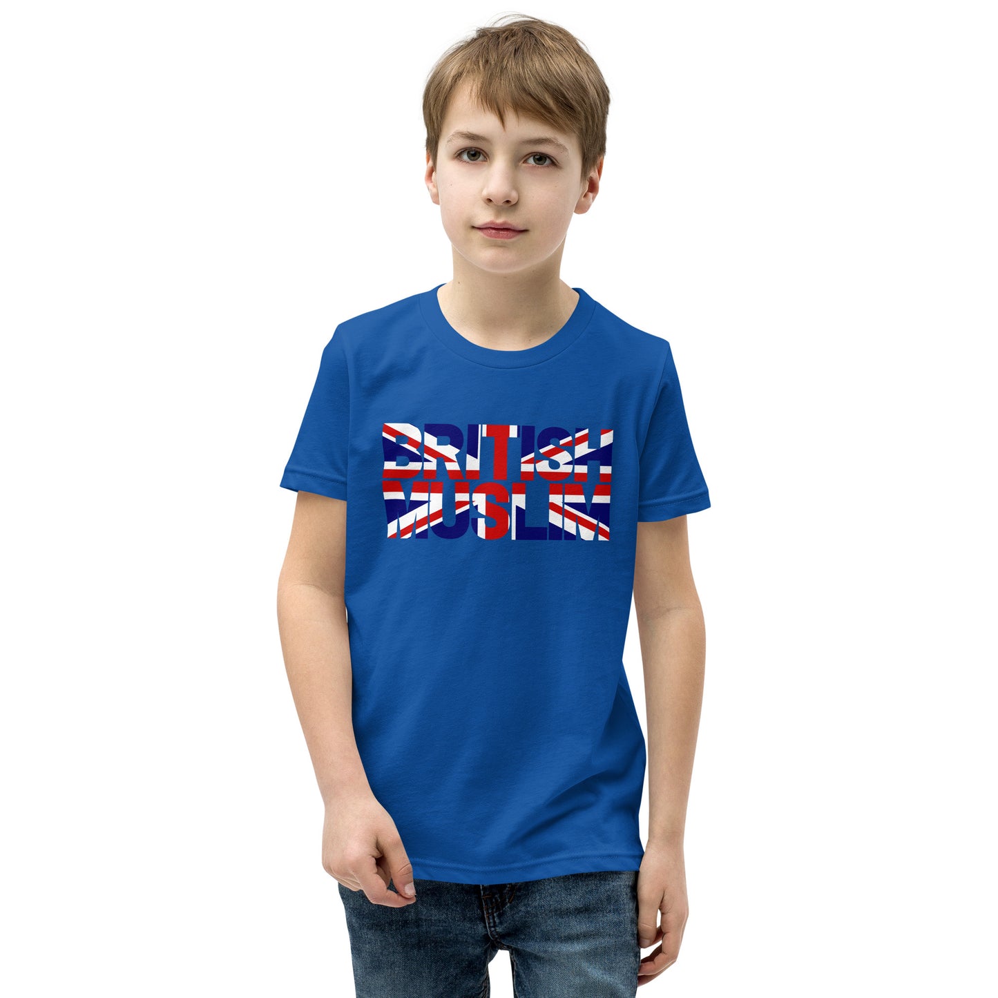 A boy wearing a true royal blue coloured Unisex T-shirt with the text saying BRITISH MUSLIM that is also in the colours of the british flag.