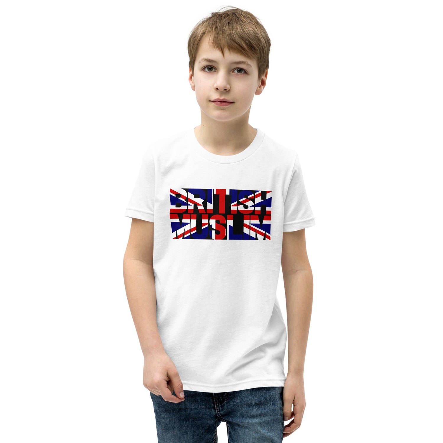 A boy wearing a white coloured Unisex T-shirt with the text saying BRITISH MUSLIM that is also in the colours of the british flag.